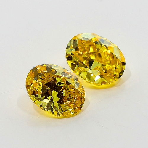 0.41 Carat Fancy Vivid Orangy  Yellow  OV VS2 GIA
